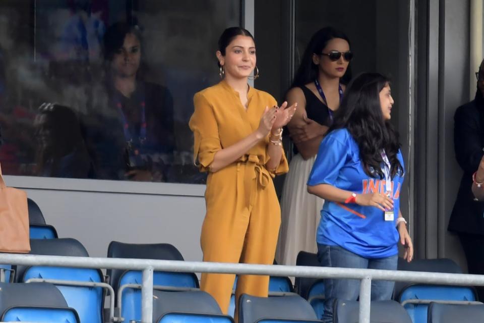 Anushka Sharma (C) applauds India's victory in the 2019 Cricket World Cup group stage match between Sri Lanka and India at Headingley in Leeds, northern England, on 6 July 2019 (AFP via Getty Images)