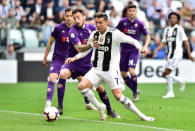 Soccer Football - Serie A - Juventus v Fiorentina - Allianz Stadium, Turin, Italy - April 20, 2019 Juventus' Cristiano Ronaldo in action with Fiorentina's Federico Ceccherini REUTERS/Massimo Pinca