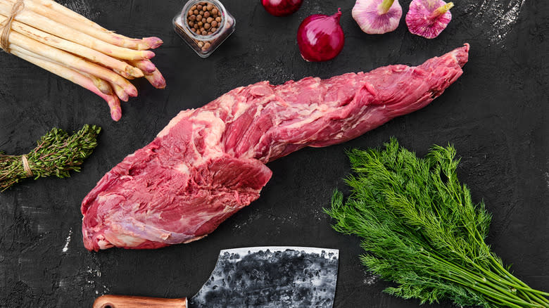 raw beef tenderloin on cutting board