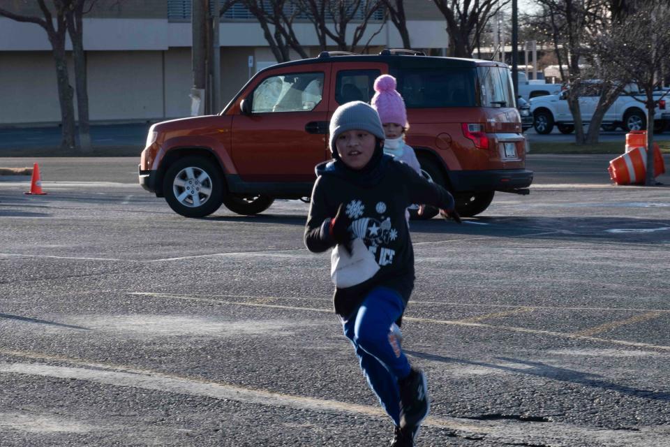 A couple of young runners head into the home stretch Saturday at the Cold As Ice run in Amarillo.