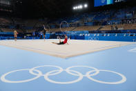 Evita Griskenas front in red, of the United States performs during a rhythmic gymnastics individual training session at the 2020 Summer Olympics, Thursday, Aug. 5, 2021, in Tokyo, Japan. (AP Photo/Markus Schreiber)