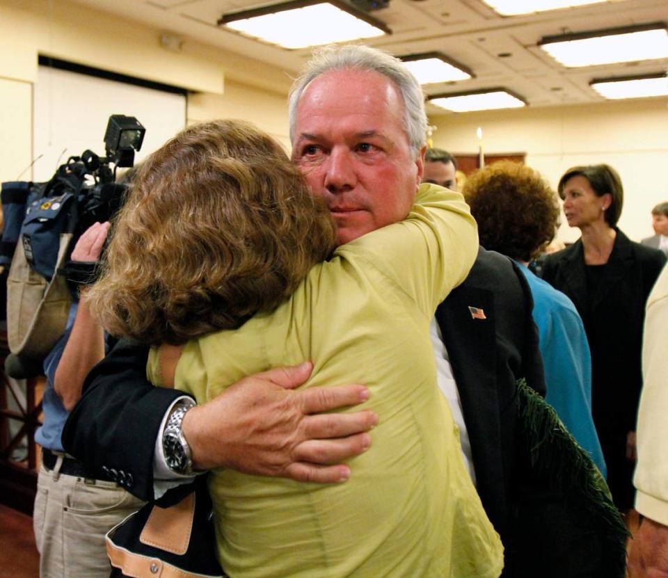 Melvin Roberts’ son David Roberts gets a hug from his wife Patty after Julia Phillips was found guilty of Melvin Roberts’ murder, at the Moss Justice Center in York. Prosecutor Kris Hodge is at right in background.