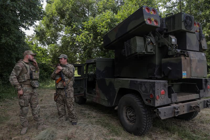 FILE PHOTO: Ukrainian servicemen stand next to an AN/TWQ-1 Avenger mobile air defence missile system outside of Kyiv