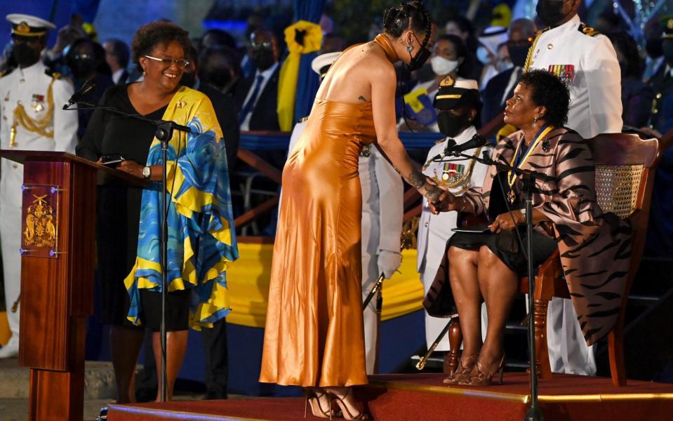 Rihanna thanks the island's first-ever president, Dame Sandra Mason, after being made a national hero - Jeff J Mitchell/Getty