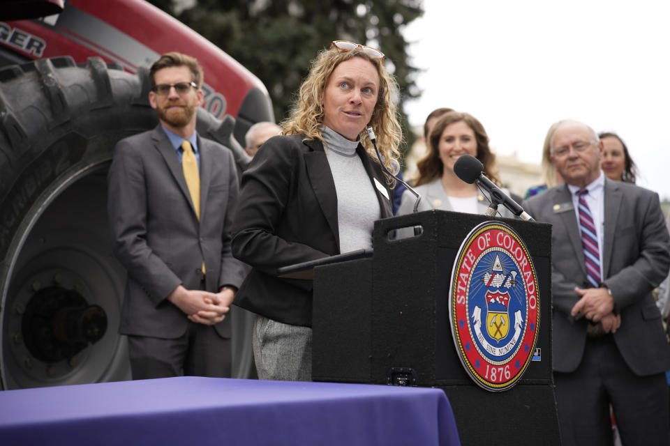 Colorado Secretary of Agriculture Kate Greenberg speaks before Colorado Gov. Jared Polis signs legislation that forces manufacturers to provide the necessary manuals, tools, parts and even software to farmers so they can fix their own machines Tuesday, April 25, 2023, during a ceremony outside the State Capitol in downtown Denver. Colorado is the first state to put the right-to-repair law into effect while at least 10 other states are considering similar measures. (AP Photo/David Zalubowski)