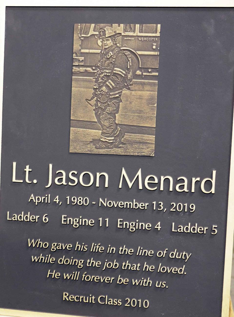 A plaque honoring fallen Worcester Fire Lt. Jason Menard at the tribute.