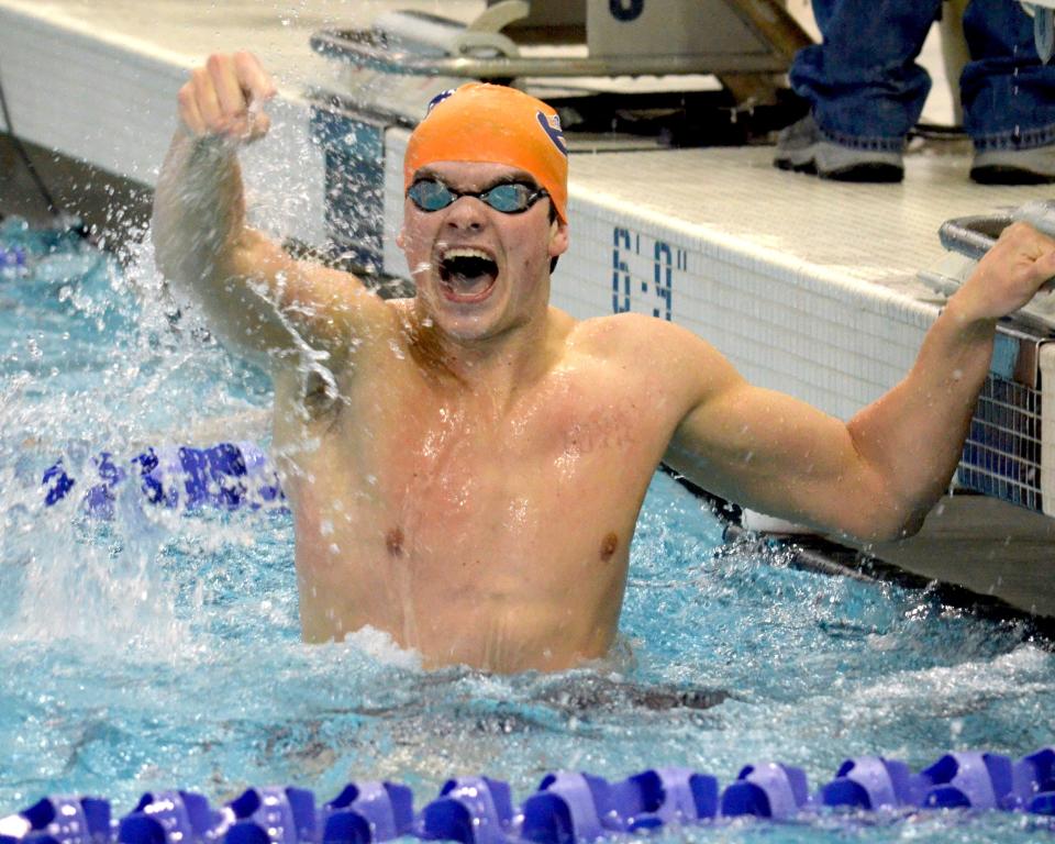 Hope's Ben Catton reacts to winning the 100 butterfly on Day 3 of the MIAA Swimming and Diving Championships at Holland Community Aquatic Center.