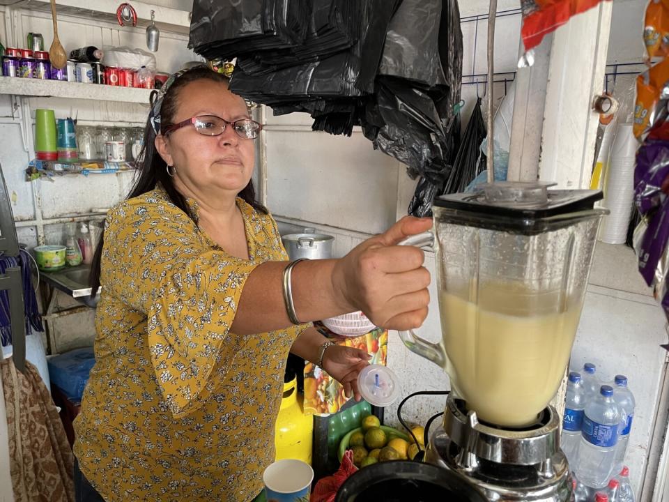 Rosa Barrera offers juices, fruits and snacks next to the central park of Sensuntepeque.