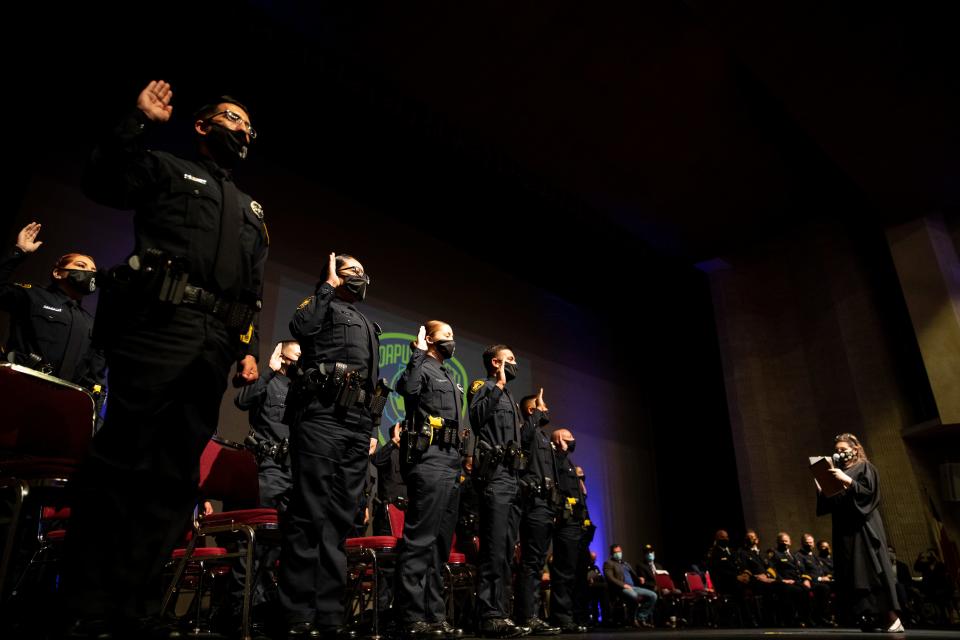 Judge Inna Klein gives the oath of office to the 79th Corpus Christi Police Academy during their graduation ceremony at the Selena Auditorium on Friday, Feb. 26, 2021.