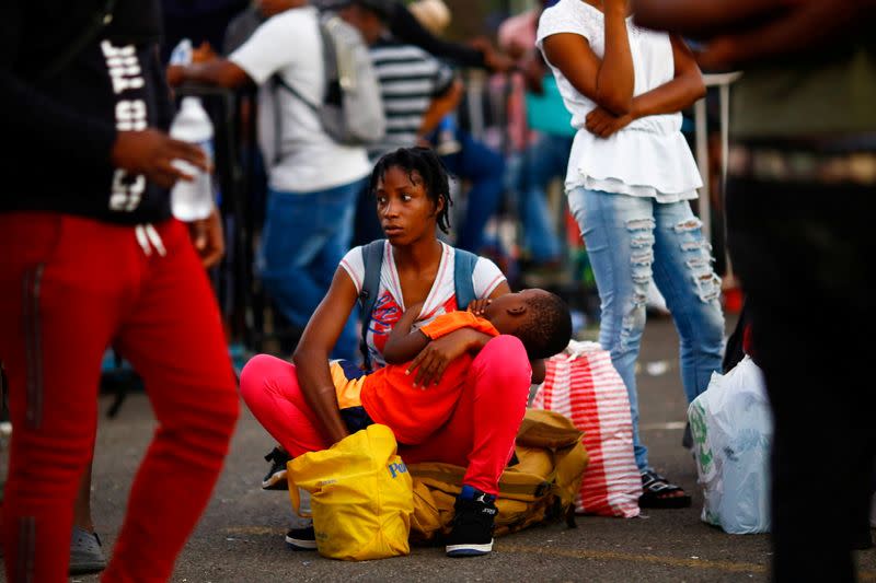 FILE PHOTO: Migrants wait as they hope to receive help from the Mexican government, in Tapachula