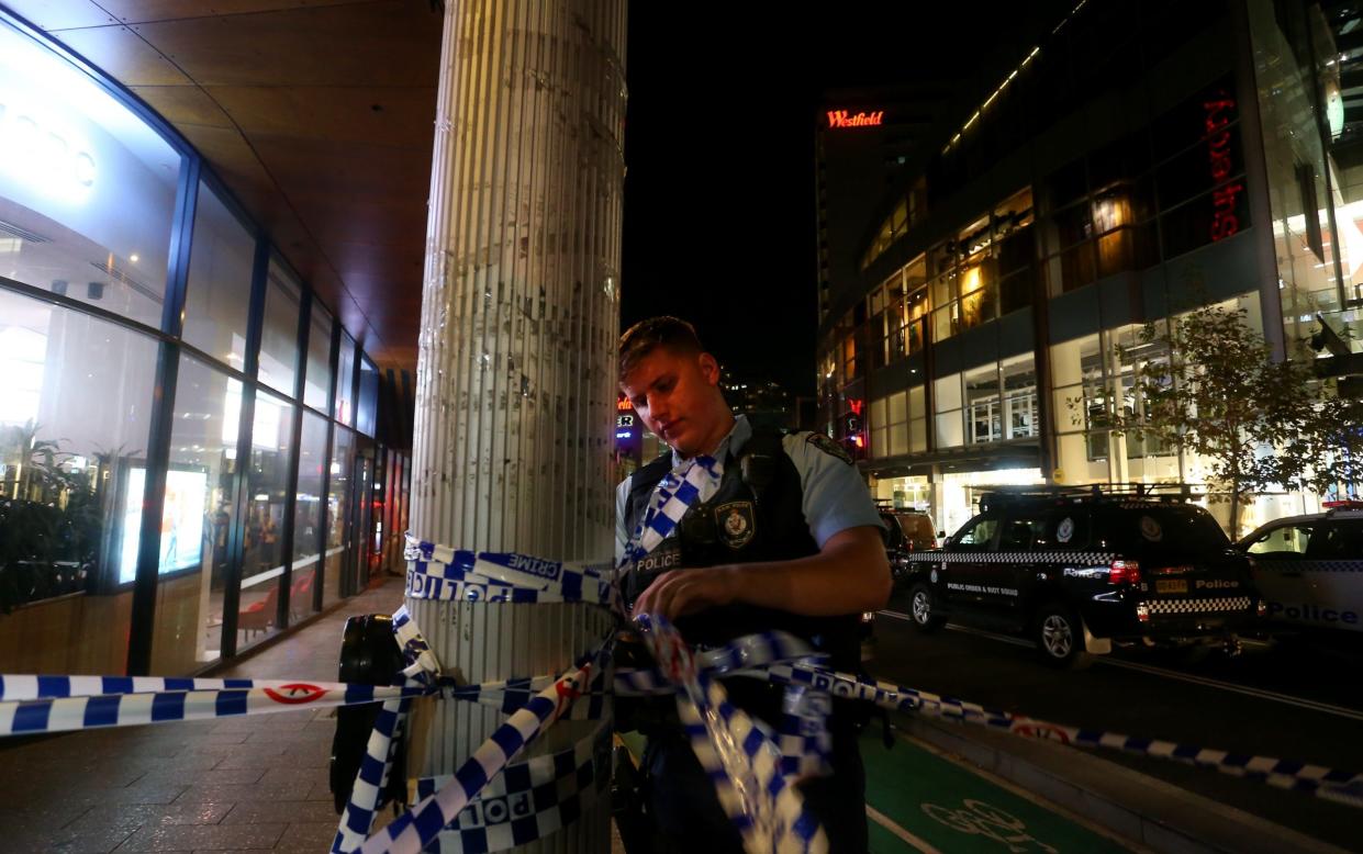 BONDI JUNCTION, AUSTRALIA - APRIL 13: NSW police cordon off an area outside Westfield Bondi Junction on April 13, 2024 in Bondi Junction, Australia. Six victims, plus the offender, are confirmed dead following an incident at Westfield Shopping Centre in Bondi Junction, Sydney. (Photo by Lisa Maree Williams/Getty Images)