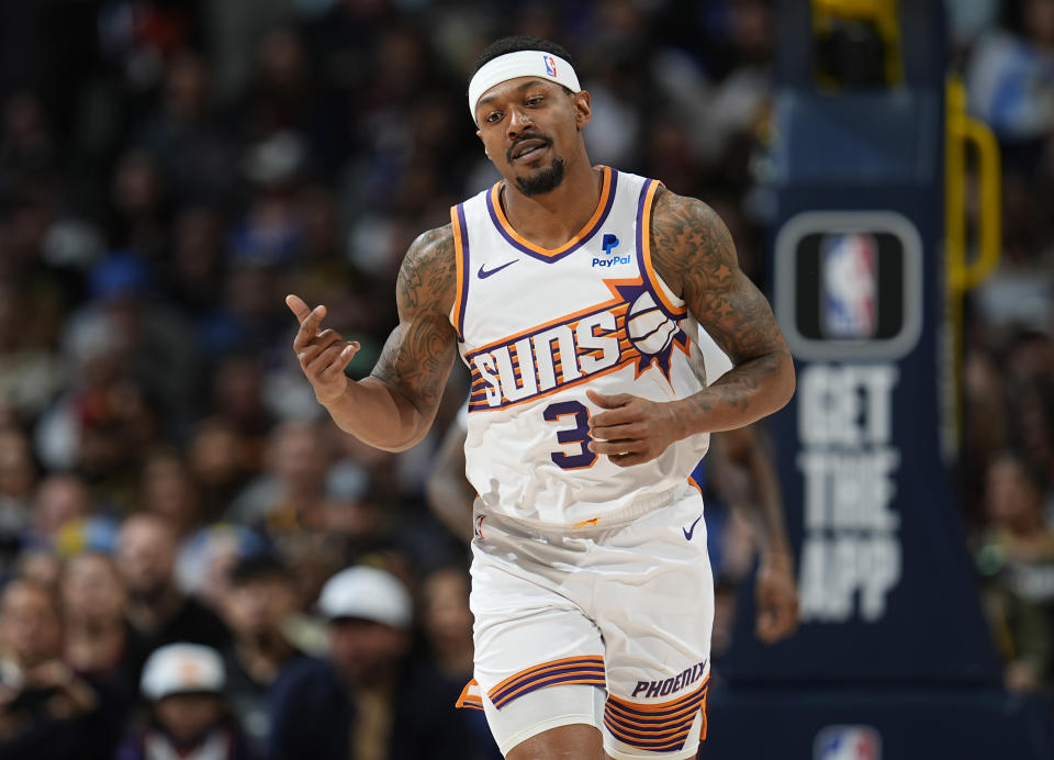 Phoenix Suns guard Bradley Beal gestures after hitting a basket against the Denver Nuggets during the second half of an NBA basketball game Tuesday, March 5, 2024, in Denver. (AP Photo/David Zalubowski)