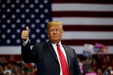 FILE PHOTO: U.S. President Donald Trump gestures to supporters during a campaign rally at the Allen County War Memorial Coliseum in Fort Wayne, Indiana, U.S., November 5, 2018. REUTERS/Carlos Barria/File Photo