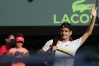 Mar 24, 2018; Key Biscayne, FL, USA; Roger Federer of Switzerland waves to the crowd while leaving the court after his match against Thanasi Kokkinakis of Australia (not pictured) on day five of the Miami Open at Tennis Center at Crandon Park. Mandatory Credit: Geoff Burke-USA TODAY Sports