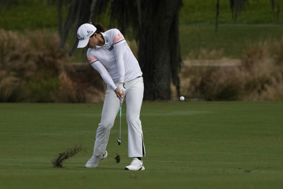 Jin Young Ko, of Korea, hits from the fairway of the ninth hole during the final round of the LPGA Tour Championship golf tournament, Sunday, Nov. 21, 2021, in Naples, Fla. (AP Photo/Rebecca Blackwell)