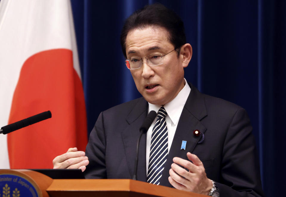 Japanese Prime Minister Fumio Kishida speaks during a press conference at the prime minister's official residence in Tokyo Tuesday, Dec. 21, 2021, as an extraordinary Diet session was closed on Tuesday. Japan’s parliament on Monday approved a record extra budget of nearly 36 trillion yen ($317 billion) for the fiscal year through March to help out pandemic-hit households and businesses.(Yoshikazu Tsuno/Pool Photo via AP)