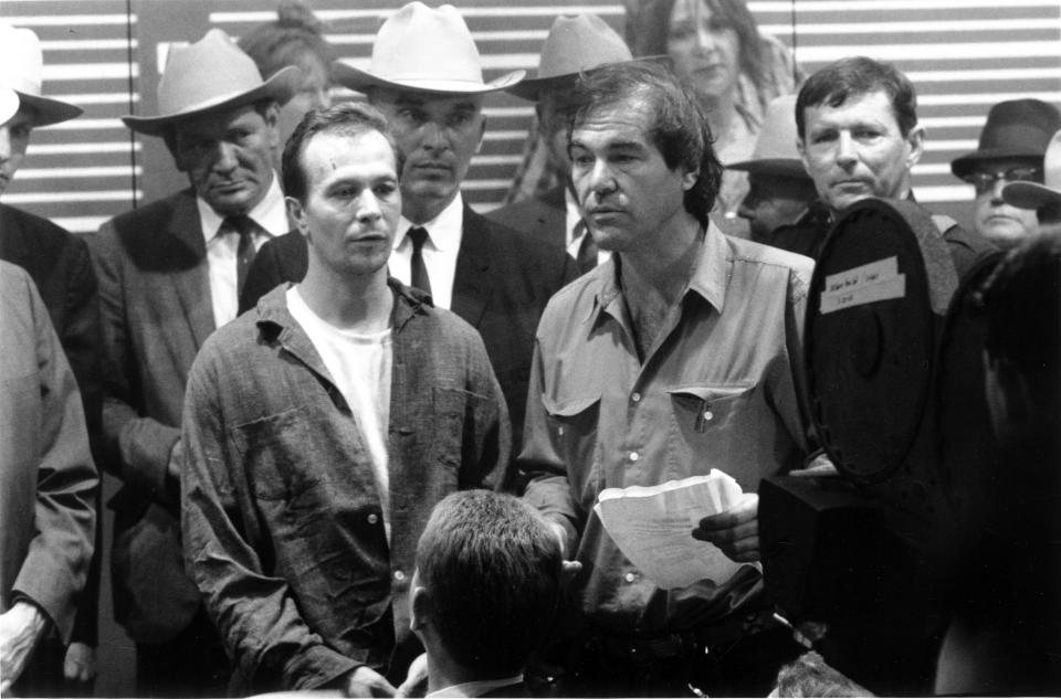 Director Oliver Stone on the set of 'JFK' with actor Gary Oldman, who played Lee Harvey Oswald.