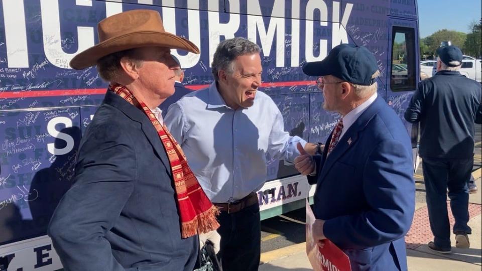 Dave McCormick, the Republican candidate for US Senate in Pennsylvania in Tuesday's primary, shares a laugh with state Sen. Frank Farry of Langhorne, right, and Vietnam War hero Dave Christian at a polling place at Bensalem High School on April 23, 2024.
