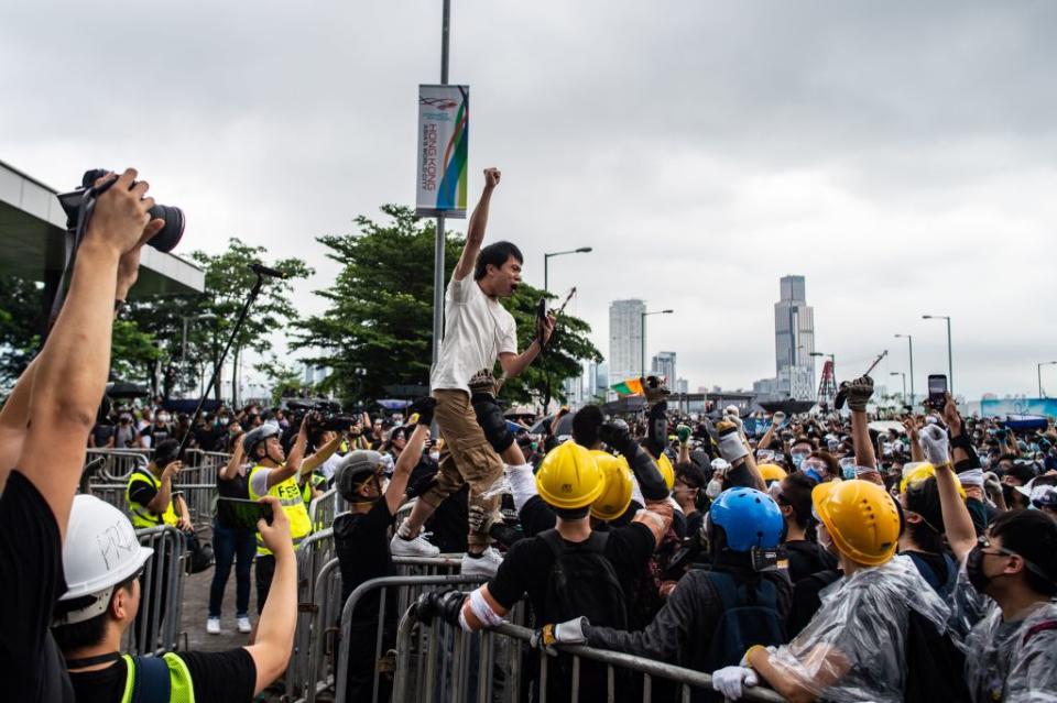 Lawmaker Roy Kwong (C) chants slogans as protesters gather outside the Legislative Council in Hong Kong on June 12, 2019. | Philip Fong—AFP/Getty Images