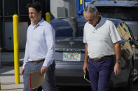 Major League Baseball Deputy Commissioner Dan Halem, left, and Commissioner Rob Manfred, right, walk after negotiations with the players association in an attempt to reach an agreement to salvage March 31 openers and a 162-game season, Monday, Feb. 28, 2022, at Roger Dean Stadium in Jupiter, Fla. (AP Photo/Lynne Sladky)