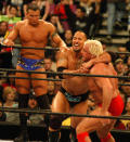 <p>Randy Orton, Dwayne “The Rock” Johnson and Ric Flair are photographed during a wrestling event. (Photo by Djamilla Rosa Cochran/WireImage) </p>