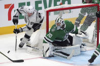 Los Angeles Kings left wing Carl Grundstrom (91) tries to shoot on Dallas Stars goaltender Braden Holtby (70) during the second period of an NHL hockey game Friday, Oct. 22, 2021, in Dallas. (AP Photo/Richard W. Rodriguez)