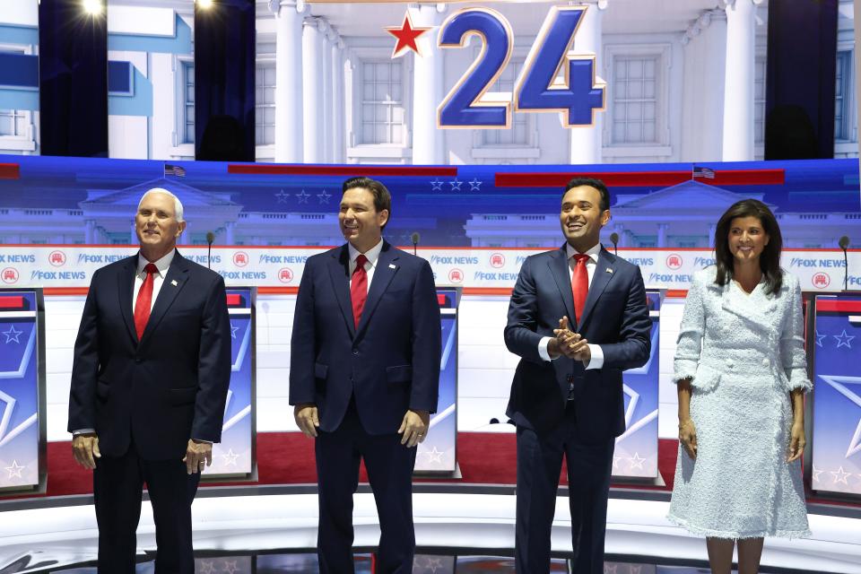 Republican presidential candidates (L-R), former U.S. Vice President Mike Pence, Florida Gov. Ron DeSantis, Vivek Ramaswamy, and former U.N. Ambassador Nikki Haley are introduced during the first debate of the GOP primary season hosted by FOX News at the Fiserv Forum on Aug. 23, 2023, in Milwaukee, Wisconsin. The 8 presidential hopefuls squared off in the first Republican debate as former U.S. President Donald Trump, currently facing indictments in four locations, declined to participate in the event.