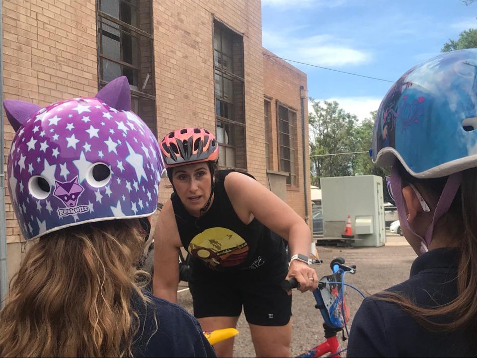 Eva Cosyleon of PACE teaches kids the "A,B,C,'s" of bike safety