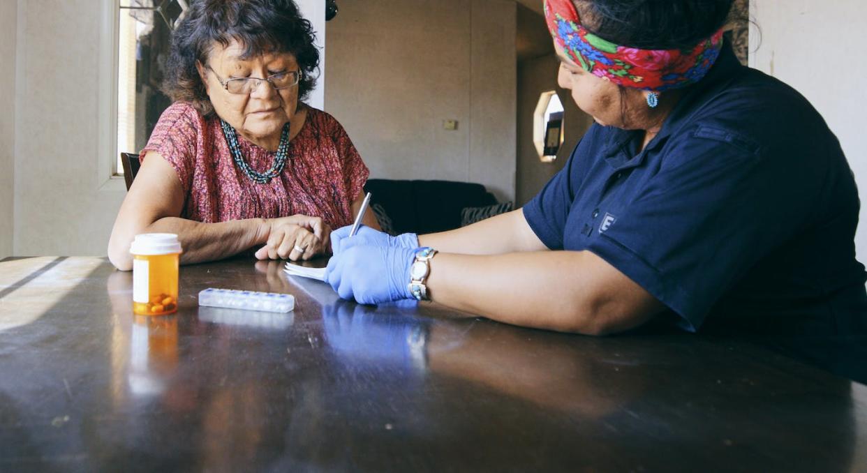 Many older people with health insurance coverage through Medicare still can't afford the care they need. <a href="https://www.gettyimages.com/detail/photo/senior-healthcare-assistance-in-a-home-royalty-free-image/1397246920?phrase=elder+care+drugs&adppopup=true" rel="nofollow noopener" target="_blank" data-ylk="slk:RichLegg/E+ via Getty Images;elm:context_link;itc:0;sec:content-canvas" class="link ">RichLegg/E+ via Getty Images</a>