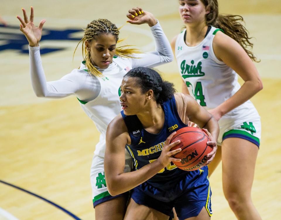 Michigan’s Naz Hillmon (0) keeps the ball away from Notre Dame’s Amirah Abdur-Rahim (3) on Dec. 3, 2020 at Purcell Pavilion in South Bend, Indiana.