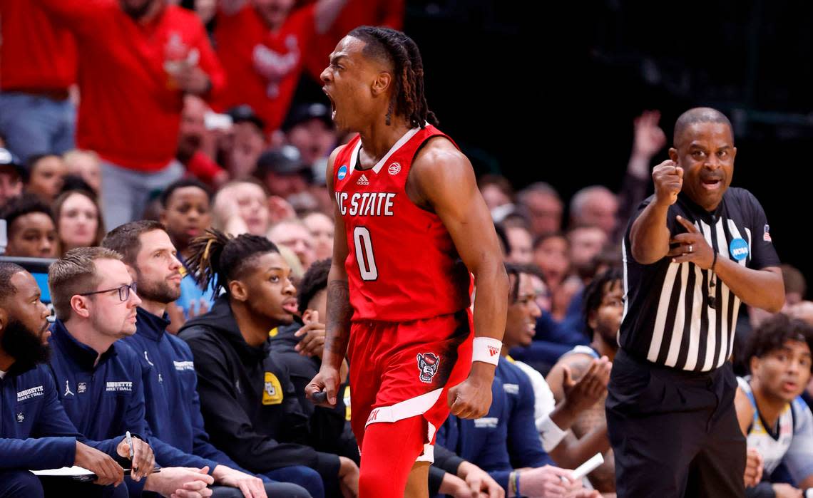 N.C. State’s DJ Horne (0) celebrates making a three-pointer while being fouled during the first half of N.C. State’s game against Marquette in their NCAA Tournament Sweet 16 game at the American Airlines Center in Dallas, Texas, Friday, March 29, 2024.