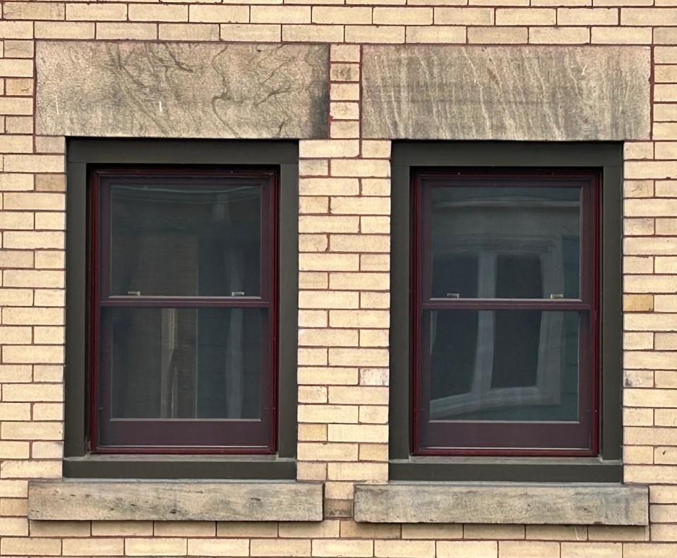 New kitchen windows at Holly Christensen's house restore the "oxblood" trim, giving a much-needed richness to the brick.