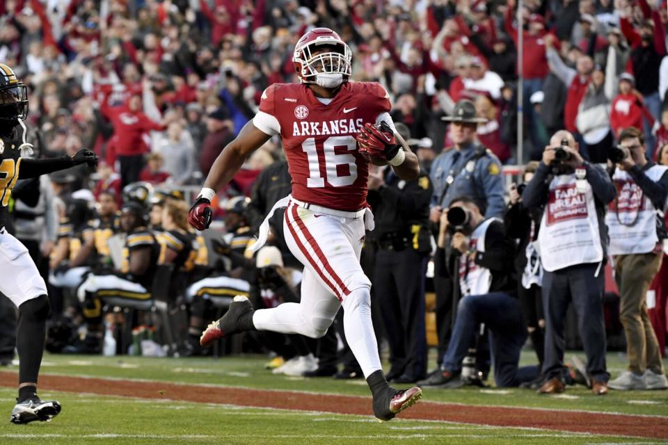 Arkansas receiver Treylon Burks runs to the end zone after a catch against Missouri in November.