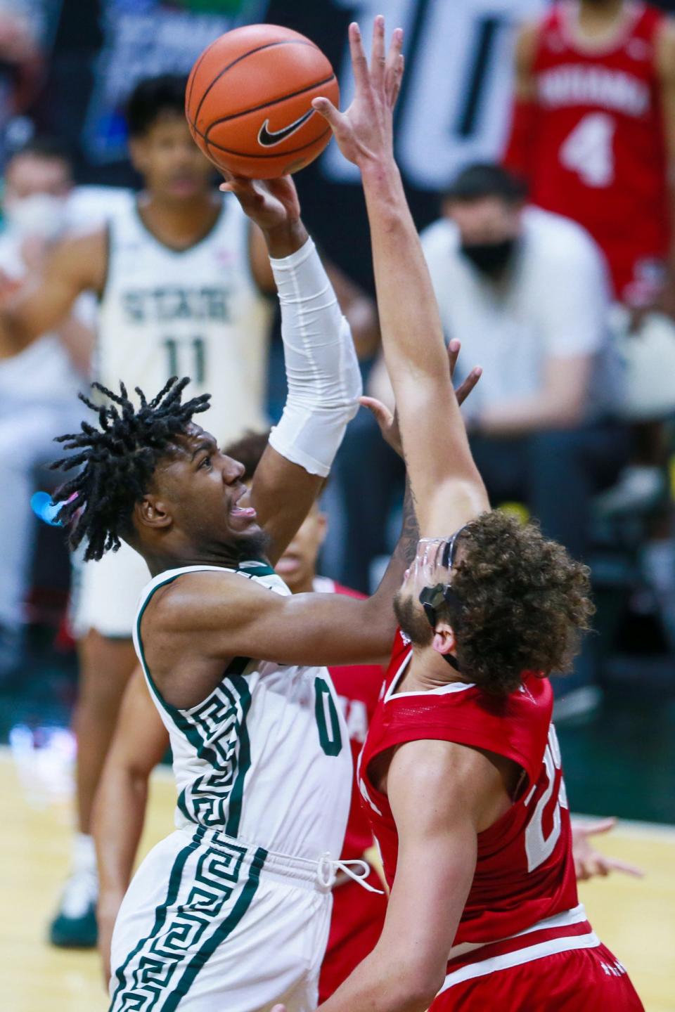 Michigan State forward Aaron Henry (0) is blocked by Indiana forward Race Thompson (25) in the first half against Indiana on Tuesday, March 2, 2021, in East Lansing.
