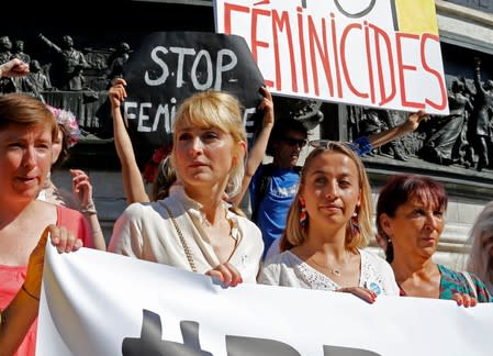 French actor Julie Gayet attends with families of victims and activists a rally against "femicide", gender-based violence targeted at women, in Paris