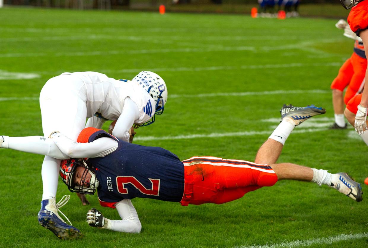 Galion's Gabe Ivy tackles Ontario's Bodpegn Miller.