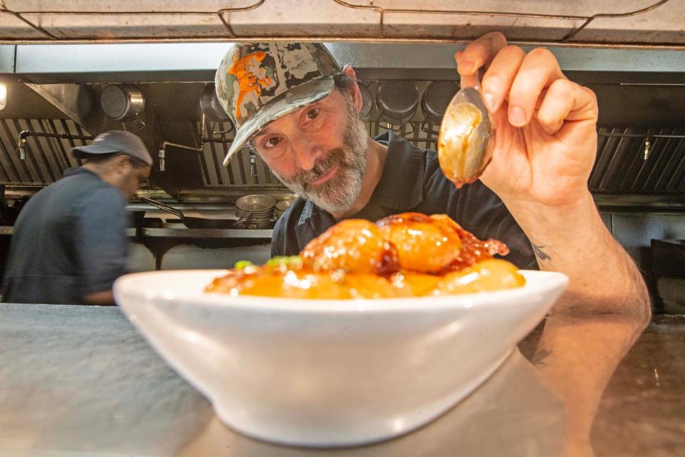 Culinary Director Steve Forte puts finishing touches on an appetizer at Harry's Savoy Grill, in Wilmington, Tuesday, Dec. 19, 2023. Harry's Savoy Grill was named one of USA Today Restaurants of the Year 2024.