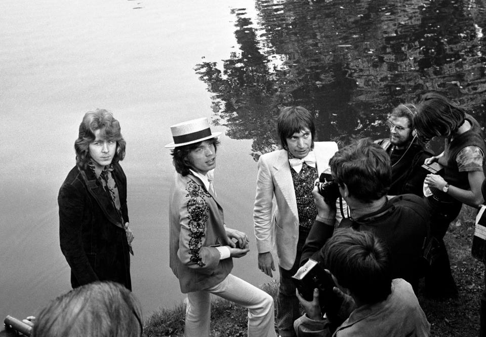 FILE - This Sept. 22 1970 file photo shows Mick Jagger, center, lead singer of The Rolling Stones pop music group, with a straw hat, as he and guitarist Mick Taylor and drummer Charlie Watts, right in bow tie, pose during a press conference at the Bois de Boulogne in Paris, France . In 1972, The Rolling Stones controversially moved to the south of France to escape onerous British taxes. Though it caused a stink at the time, it spawned one of the group’s most seminal albums, “Exile on Main St.” The title is a reference to their tax-dodging. (AP Photo, Cardenas, File)