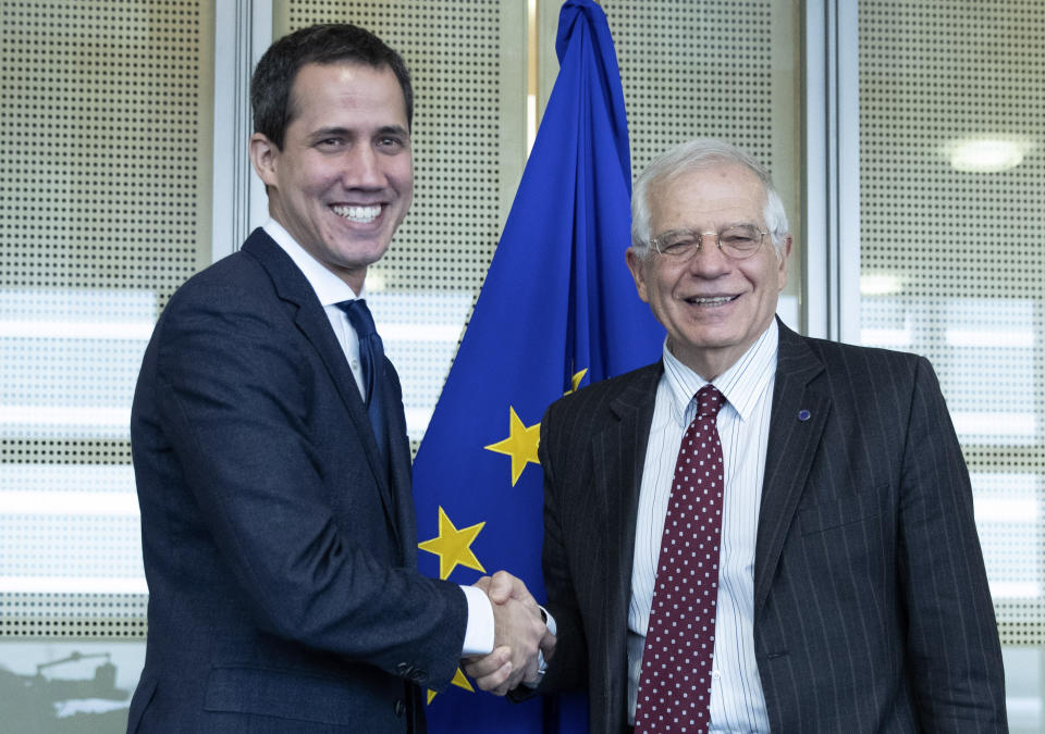 European Union foreign policy chief Josep Borrell, right, shakes hands with the leader of Venezuela's political opposition Juan Guaido prior to a meeting at EU headquarters on Wednesday, Jan. 22, 2020. (Aris Oikonomou, Pool Photo via AP)