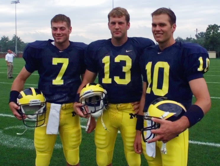 Drew Henson, (7), Jason Kapsner, (13) and Tom Brady (10) pose during Michigan's media day before the 1999 season. (AP)