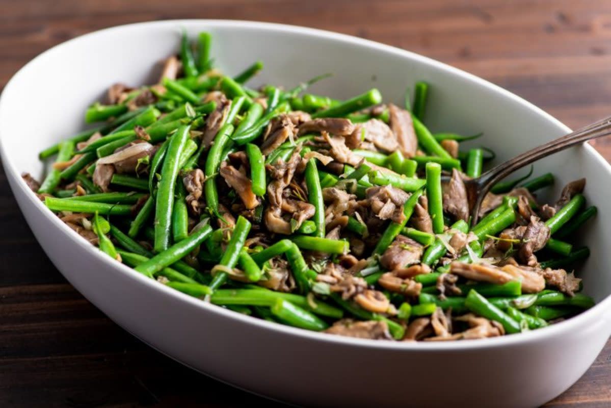 <p>Courtesy of Katie Workman</p><p>Sautéed green beans and mushrooms belong on pretty much any holiday table.</p><p><strong>Get the Recipe: </strong><a href="https://themom100.com/recipe/green-beans-and-mushrooms-with-shallots/" rel="nofollow noopener" target="_blank" data-ylk="slk:Green Beans and Mushrooms with Shallots;elm:context_link;itc:0;sec:content-canvas" class="link rapid-noclick-resp"><strong>Green Beans and Mushrooms with Shallots</strong></a></p>