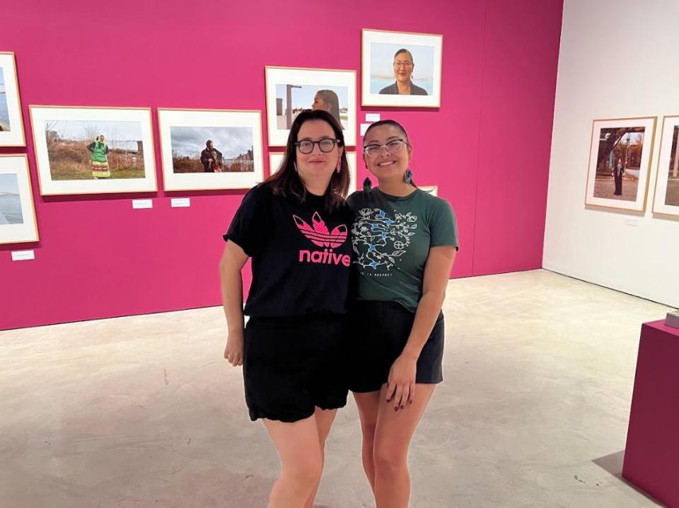 Julie Rae Tucker and Shayenne Nolan pose together in the 'Waawiiatanong Forever' exhibit at Art Windsor-Essex.