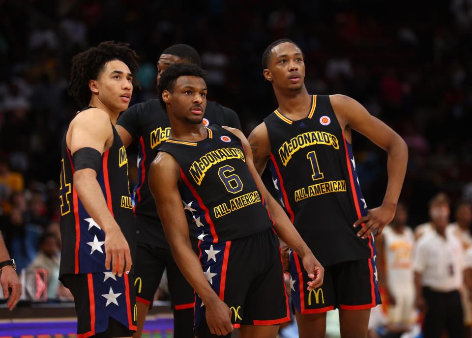 Jared McCain, left, Bronny James, center, and Ron Holland during the McDonald's All American Boy's high school basketball game in March.