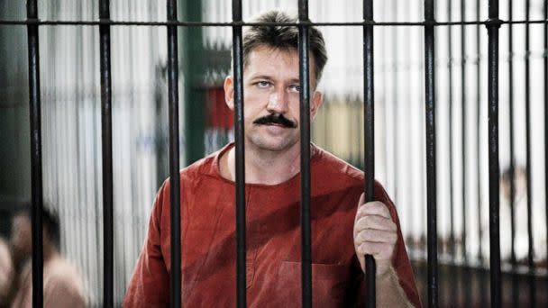 PHOTO: Viktor Bout looks from behind bars at the Criminal Court in Bangkok, Oct. 10, 2008. (Nicolas Asfouri/AFP via Getty Images)