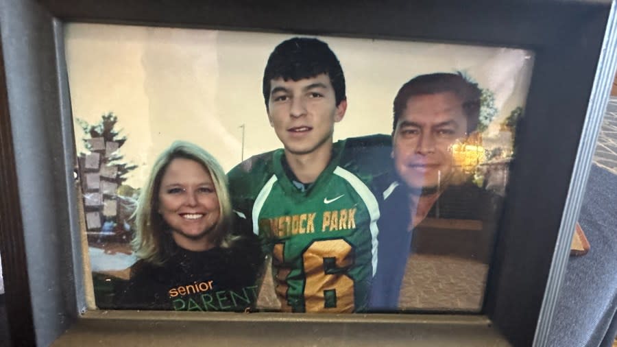 A photo of a young Capt. Miguel Nava, a U.S. Marine from Comstock Park who was killed in a helicopter crash, and his parents. (March 3, 2024)