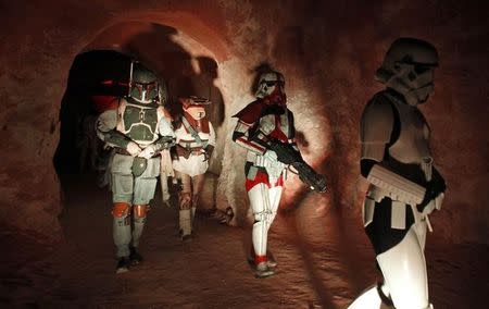 People dressed up as characters from the Star Wars movies take part in a parade during a tourism event in the Star Wars movie set at Ong Jmal, in Nefta May 3, 2014. REUTERS/Zoubeir Souissi