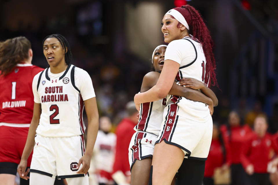 CLEVELAND, OHIO - APRIL 5: Raven Johnson #25 of the South Carolina Gamecocks and Kamilla Cardoso #10 of the South Carolina Gamecocks celebrate against the NC State Wolfpack during the NCAA Women's Basketball Tournament Final Four semifinal game at Rocket Mortgage Fieldhouse on April 5, 2024 in Cleveland, Ohio. (Photo by C. Morgan Engel/NCAA Photos via Getty Images)