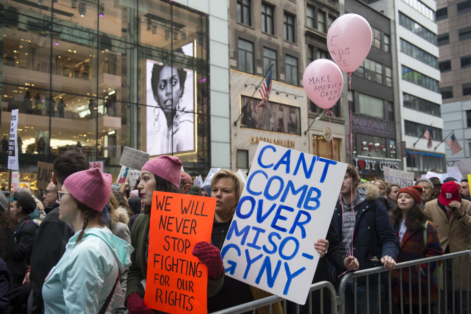 A protestor carries an anti-misogyny poster at the Women’s March in New York City. (Getty Images)