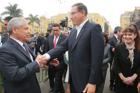 Peruvian President Martin Vizcarra greets Prime Minister Cesar Villanueva outside Government Palace in Lima, Peru September 19, 2018. Courtesy of Presidential Palace/Handout via REUTERS