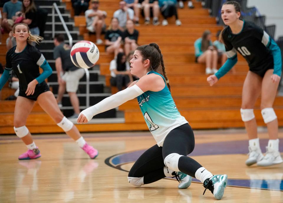 Gulf Coast Sharks libero Casey Williams (11) digs the ball during the Class 5A Region 3 championship against the Barron Collier Cougars at Barron Collier High School in Naples on Wednesday, Nov. 1, 2023.